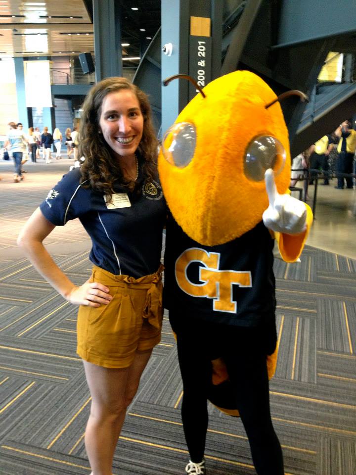 Becky Byler with the Buzz mascot